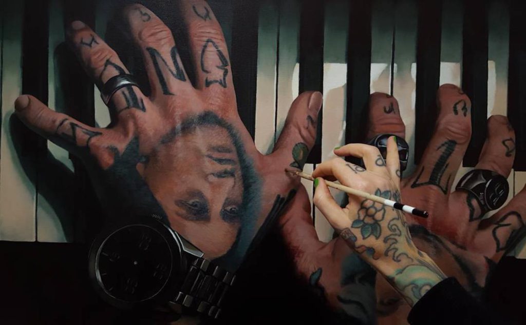 getatoeëerde handen hand-tattoos